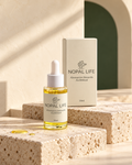 Serum-huile au bakuchiol Nopal Life 30 ml, alternative naturelle au retinol, flacon verre et etui sur pierre travertin