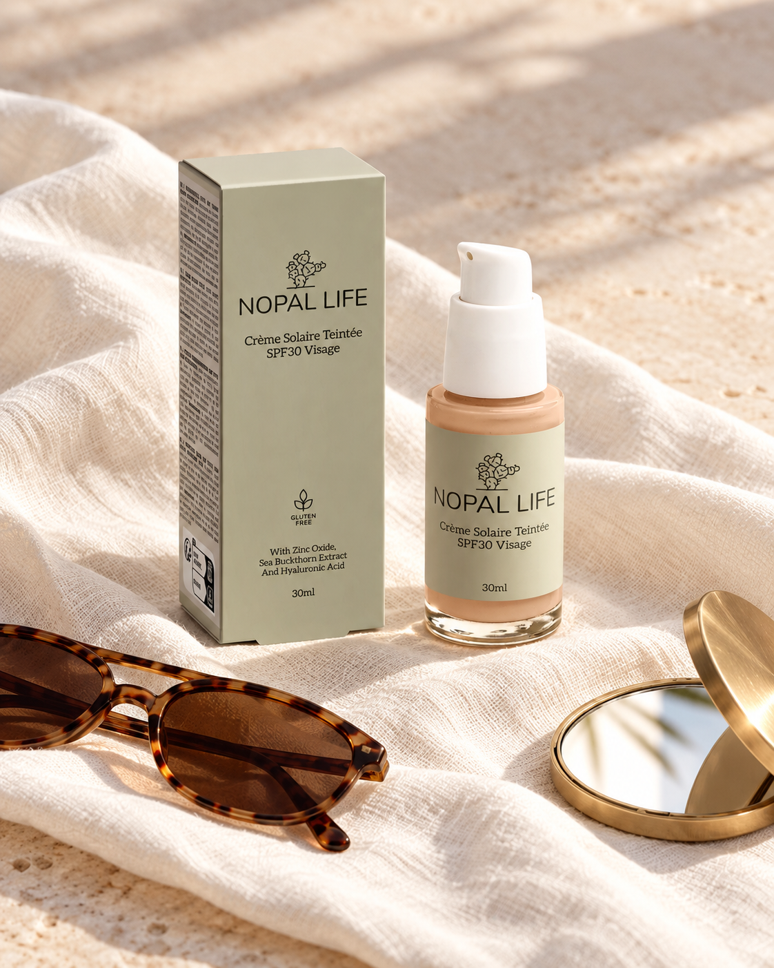 Creme solaire teintee SPF30 Nopal Life avec lunettes de soleil sur lin, routine estivale protection visage